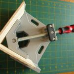 Corner clamp holding wood at 90 degree angle