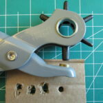 Hole made with a hole punch tool