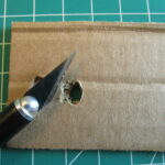Hole made with X-ACTO knife